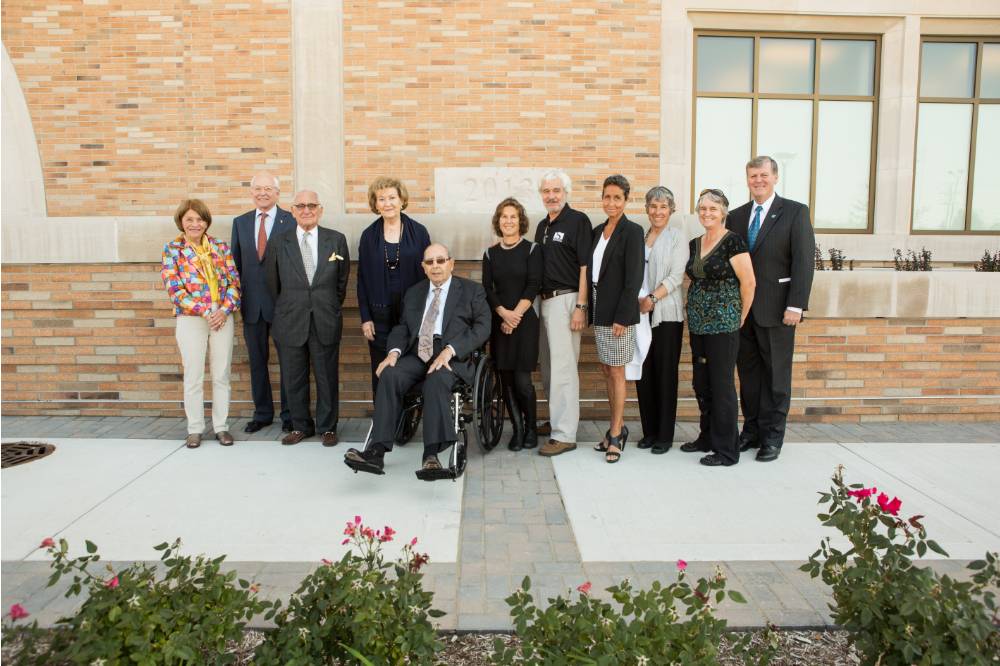 Richard and Helen Devos standing with the Seidman family, and President Emeritus Tom Haas.